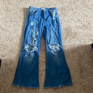 Rue21 flare ripped jeans in the size 3 and a darkish blue color